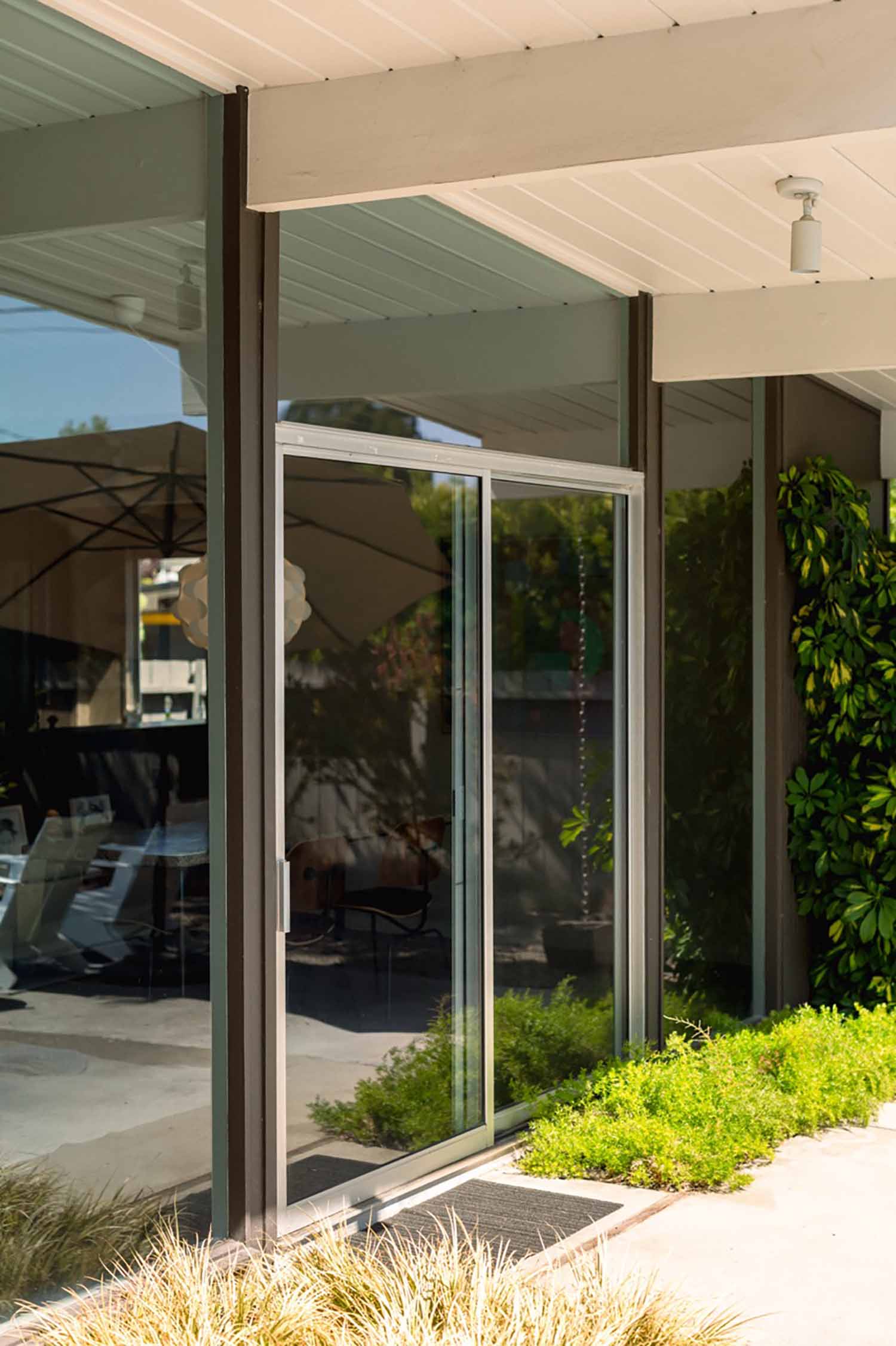 Clear views, lower bills – This large floor-to-ceiling window is treated with solar control film, enhancing comfort without blocking the view of the serene outdoor landscape.