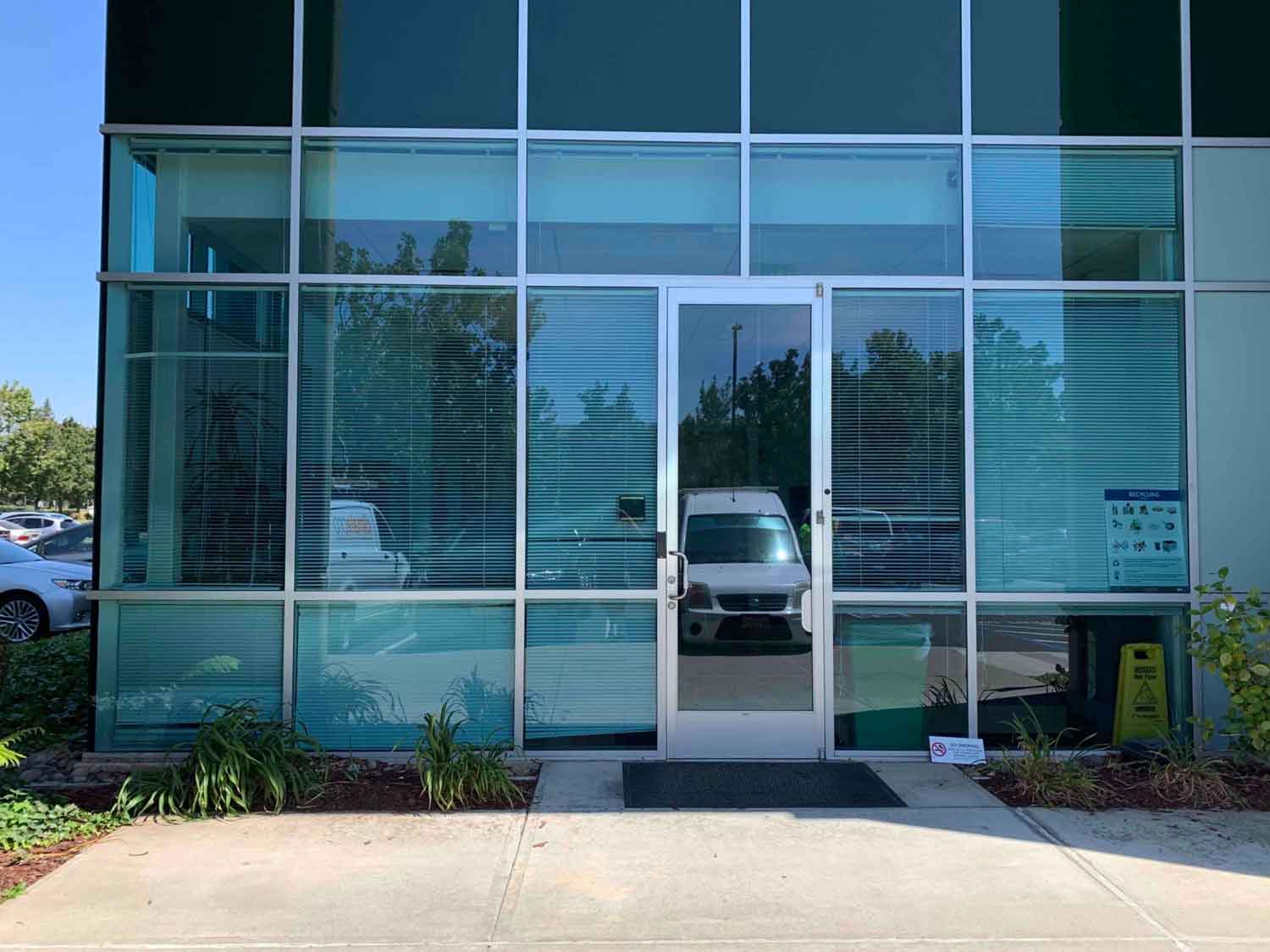 Front entrance of a Hayward office with newly installed 3M Sun Control Window Film.