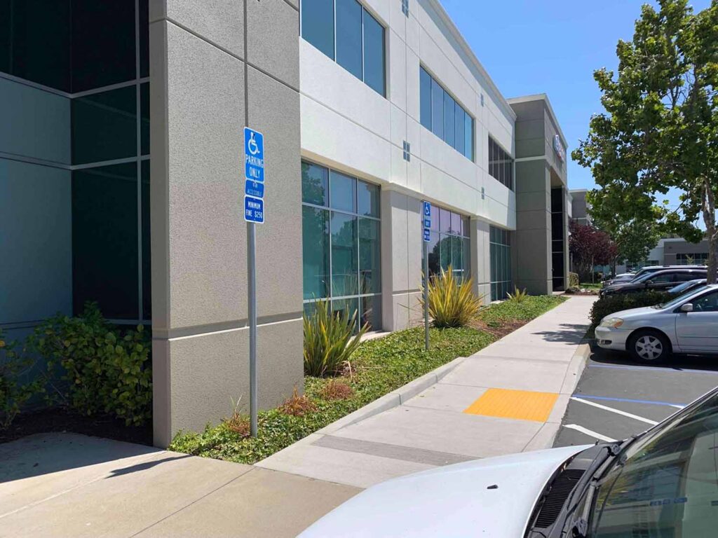 Close-up of tinted windows on a Hayward office, reducing glare and heat while maintaining visibility